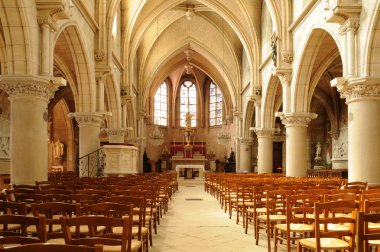 The interior of the church of Vigny in Val d Oise clipart