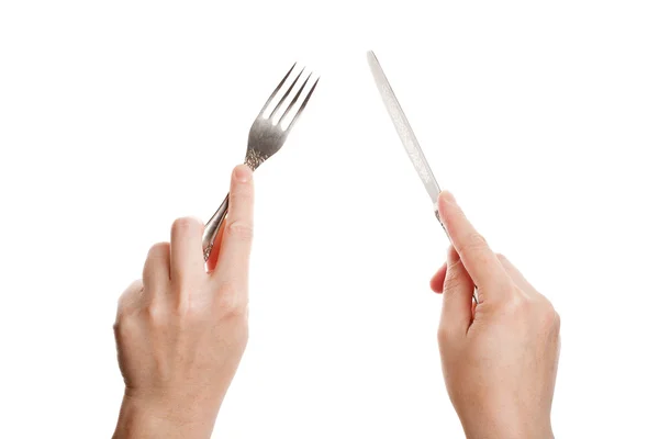 Cuchillo y tenedor en las manos — Foto de Stock