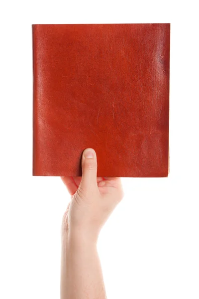 Gesloten boek in de hand — Stockfoto