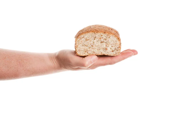 Hand keeping loaf of baked bread — Stock Photo, Image