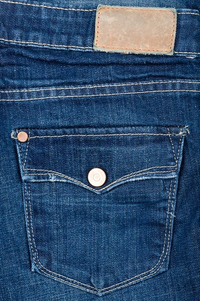 Modré džíny tkanina s kapsou a popisku — Stock fotografie