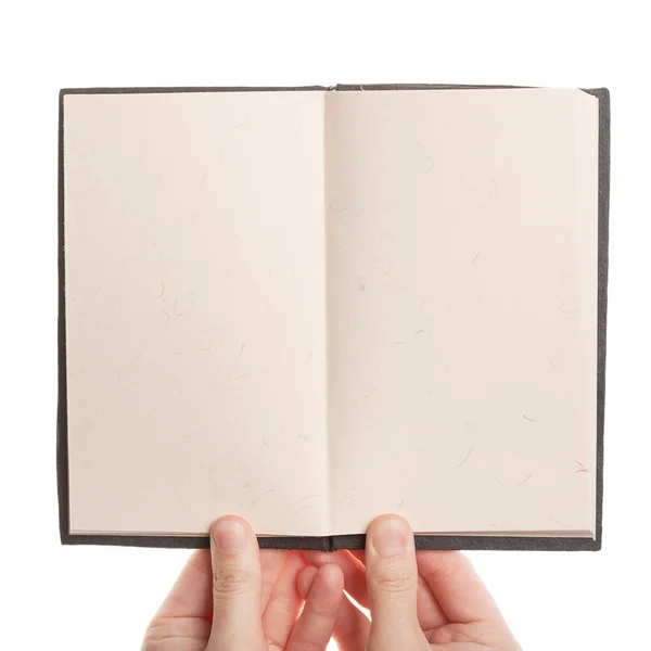 Buch in Händen aufgeschlagen — Stockfoto
