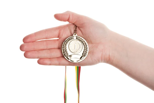 Gold medal in hand — Stock Photo, Image