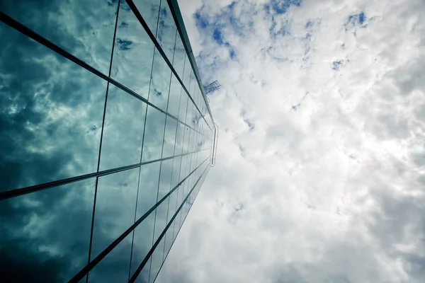 stock image Glass wall of a skyscraper and a sky