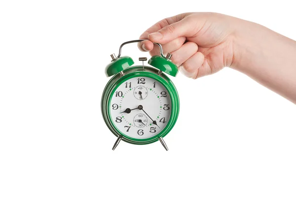 Mão segurando relógio de alarme — Fotografia de Stock