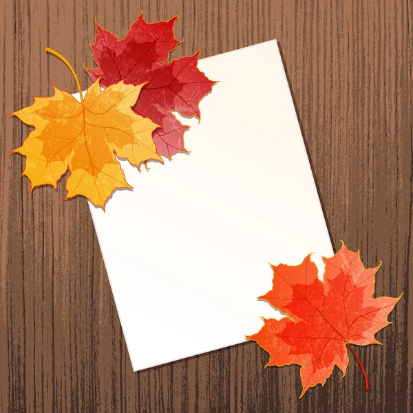 Кленовые листья с бумажным листом — стоковый вектор