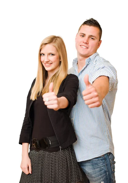Atraente jovem casal mostrando polegares para cima . — Fotografia de Stock