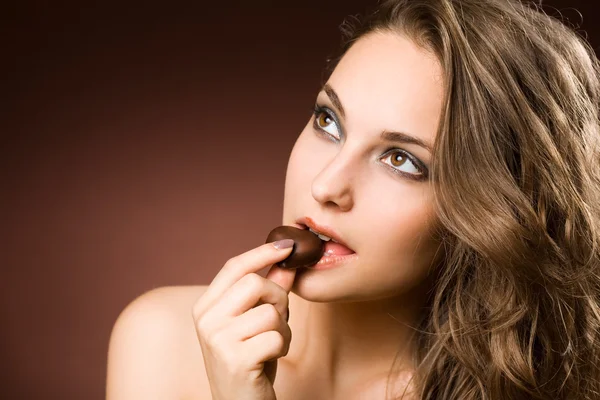 Chocolate loving brunette beauty — Stock Photo, Image