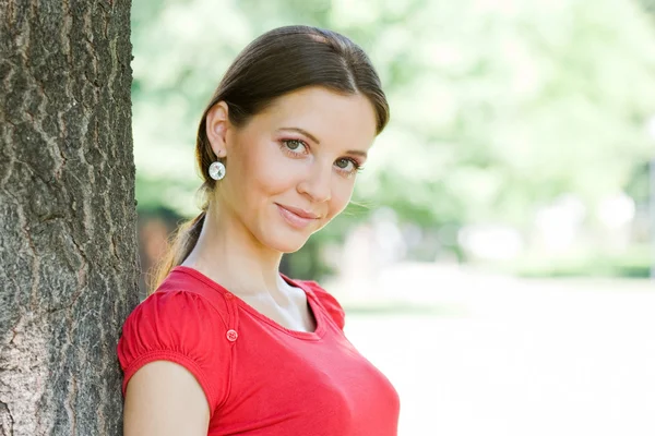 Attractive happy young brunette woman. — Stock Photo, Image