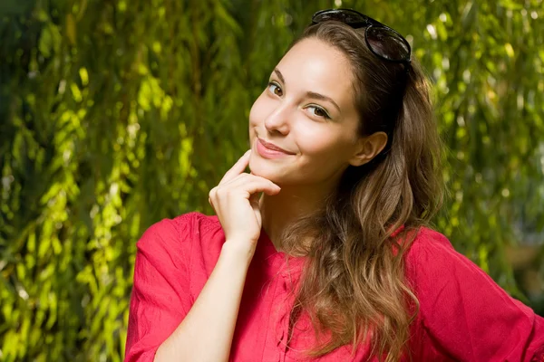 Cheerful thinking young brunette woman. — Stock Photo, Image