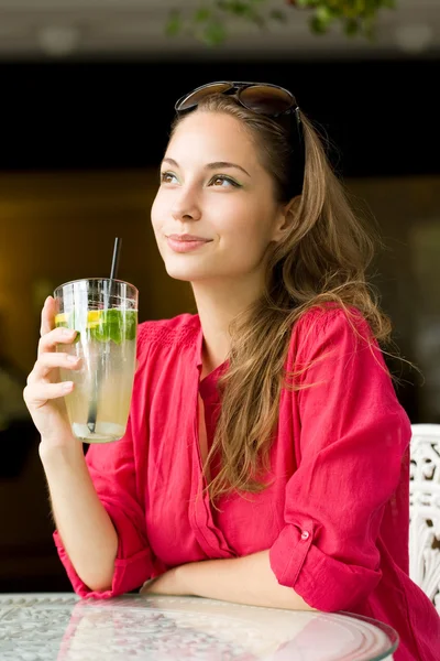 Young brunette with cool refreshment. — Stock Photo, Image