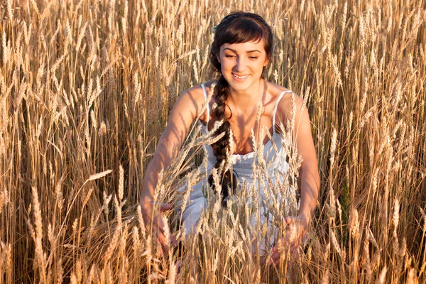 stock image Woman in white dress in field with wheat