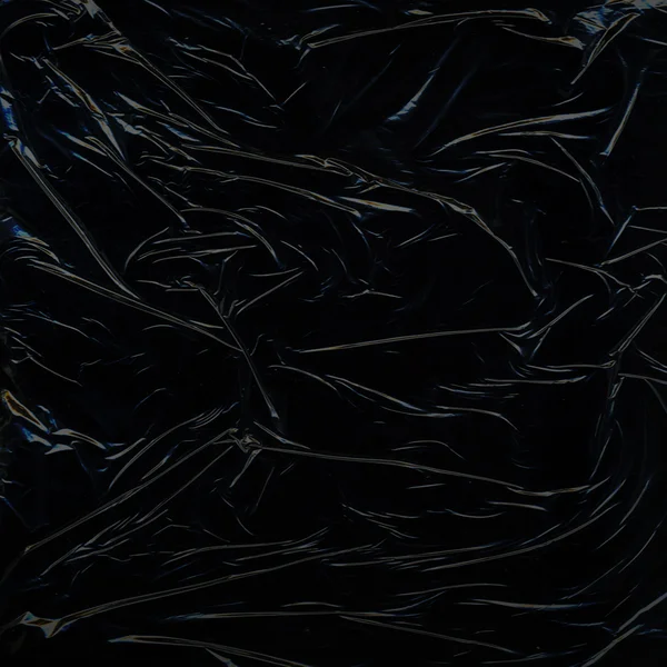 Schwarze glänzende Folie — Stockfoto