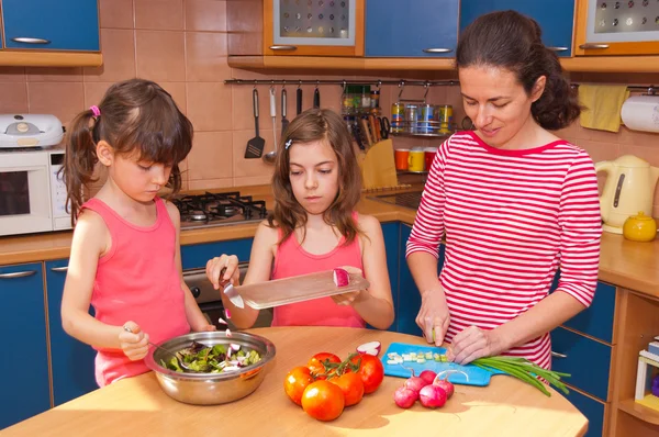 Family cooking at home — Stock Photo, Image