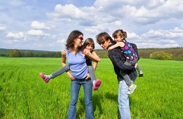Happy family outdoors having fun — Stock Photo, Image