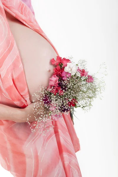 Terhes nő hasa virágokkal — Stock Fotó