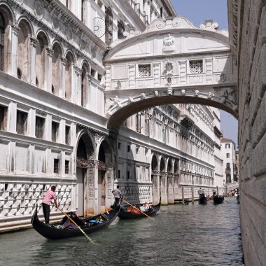 Gondolas passing over Bridge of Sighs clipart