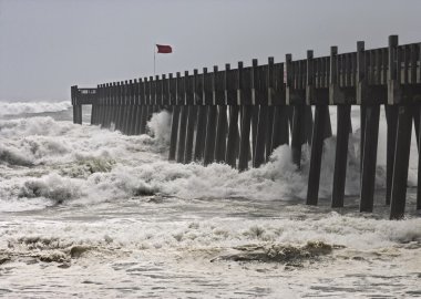 Hurricane Moves Onshore at Florida Pier clipart