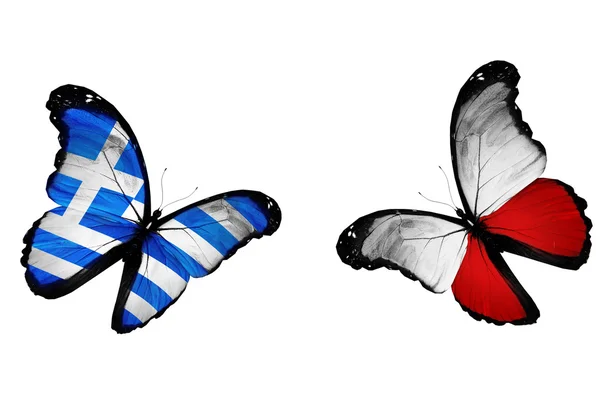 Концепция - две бабочки с греческими и польскими флагами — стоковое фото
