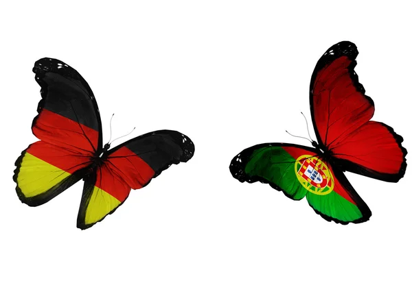 Concepto - dos mariposas con bandera alemana y portuguesa flyin —  Fotos de Stock