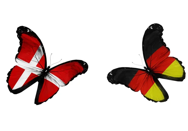 Concept - two butterflies with Danish and German flags flying — Stock Photo, Image
