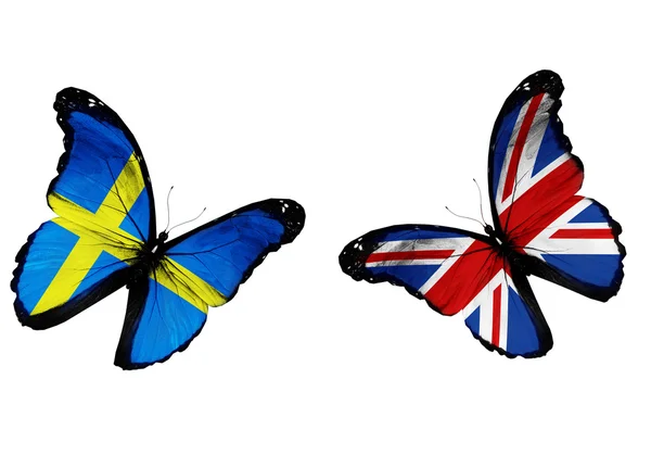 Concept - two butterflies with Swedish and English flags flying — Stock Photo, Image