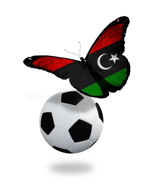 Концепция - бабочка с ливийским флагом, летящим рядом с мячом, как — стоковое фото