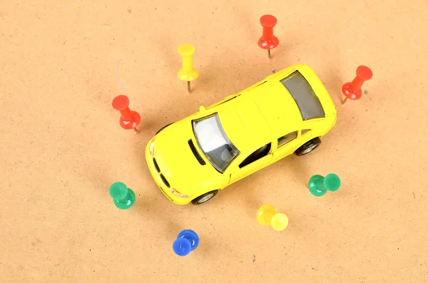 stock image Toy car and push pin