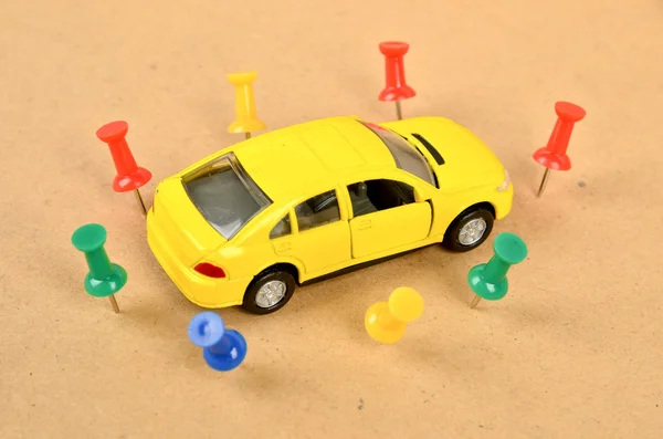 Toy car and push pin — Stock Photo, Image