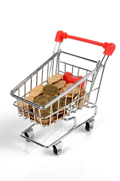 Coins in shopping cart — Stock Photo, Image