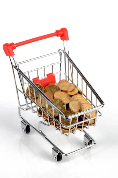 Coins in shopping cart — Stock Photo, Image