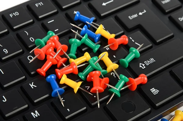 Computer keyboard and push pin — Stock Photo, Image