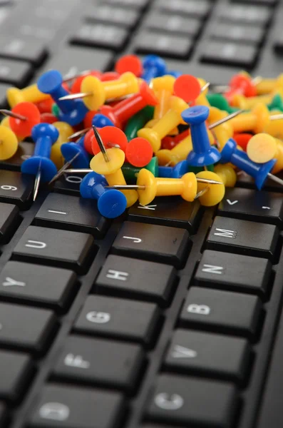 Computer keyboard and push pin — Stock Photo, Image