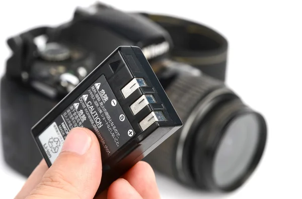 Батарея и DSLR — стоковое фото