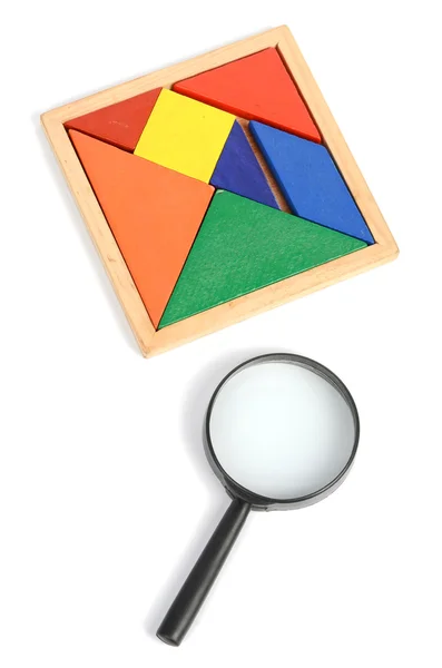 Chinese tangram and magnifier — Stock Photo, Image