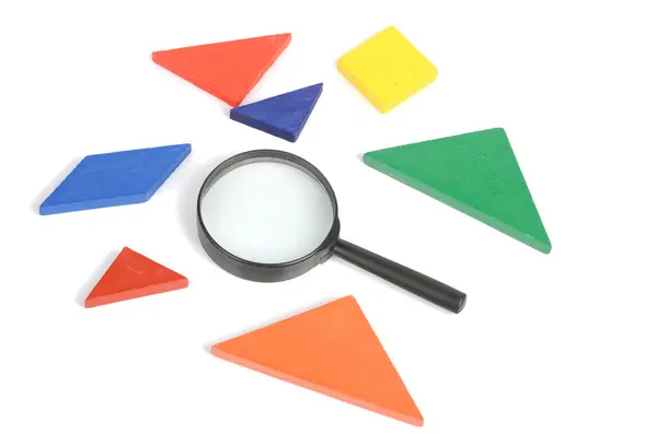 stock image Chinese tangram and magnifier