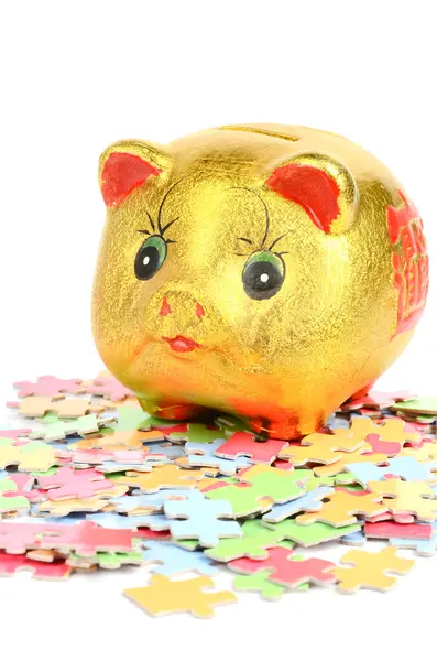 Puzzle and piggy bank — Stock Photo, Image