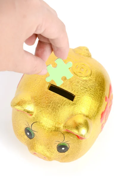 Puzzle and piggy bank — Stock Photo, Image