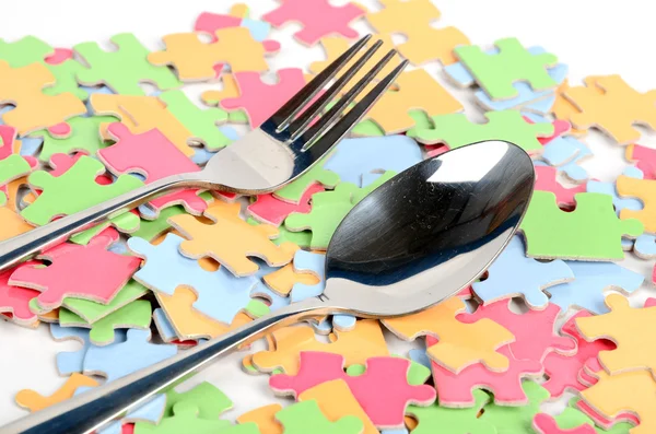 Puzzle and table ware — Stock Photo, Image