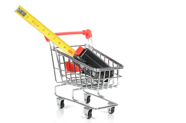 Shopping cart and tape line — Stock Photo, Image