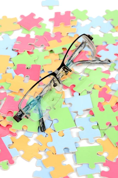 Eye glasses and puzzle — Stock Photo, Image