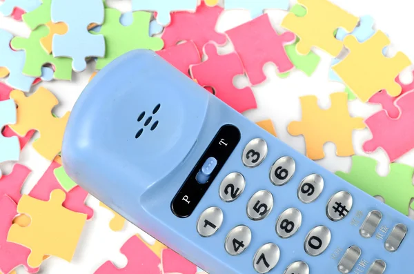 Telephone and puzzle — Stock Photo, Image