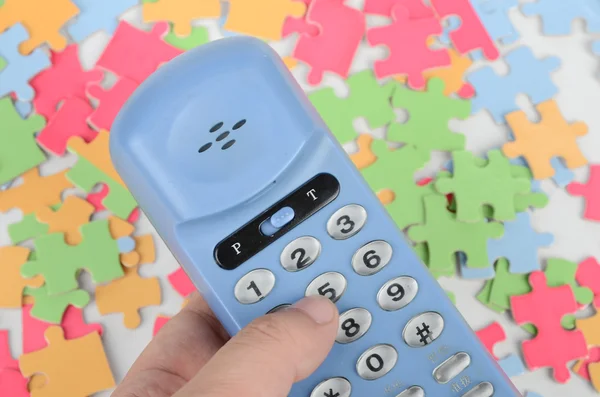 Telephone and puzzle — Stock Photo, Image