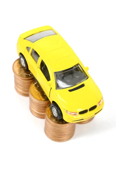 Carro de brinquedo e moeda — Fotografia de Stock