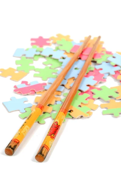 Puzzle and chopstick — Stock Photo, Image