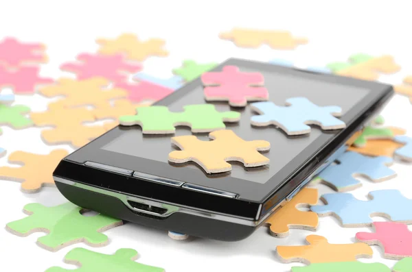 Puzzle e smartphone — Foto Stock