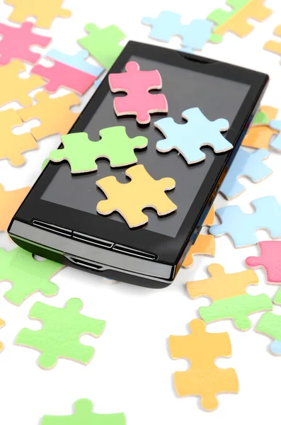Puzzle e telefone inteligente — Fotografia de Stock