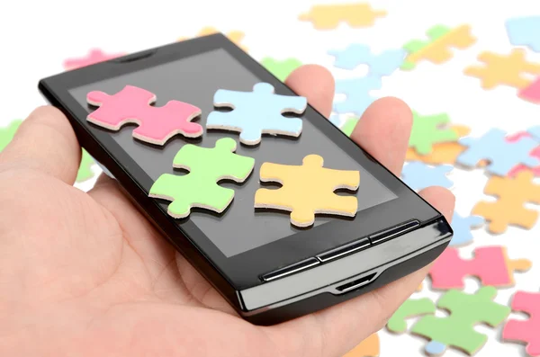 Puzzle und Smartphone — Stockfoto