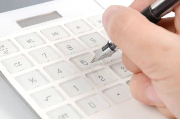 Calculadora e caneta — Fotografia de Stock