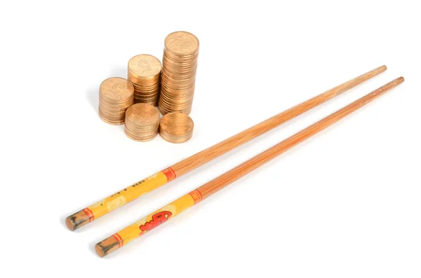 Golden coin and chopstick — Stock Photo, Image